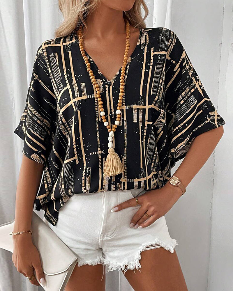 Bedruckte Retro-Bluse mit Fledermausärmeln und V-Ausschnitt