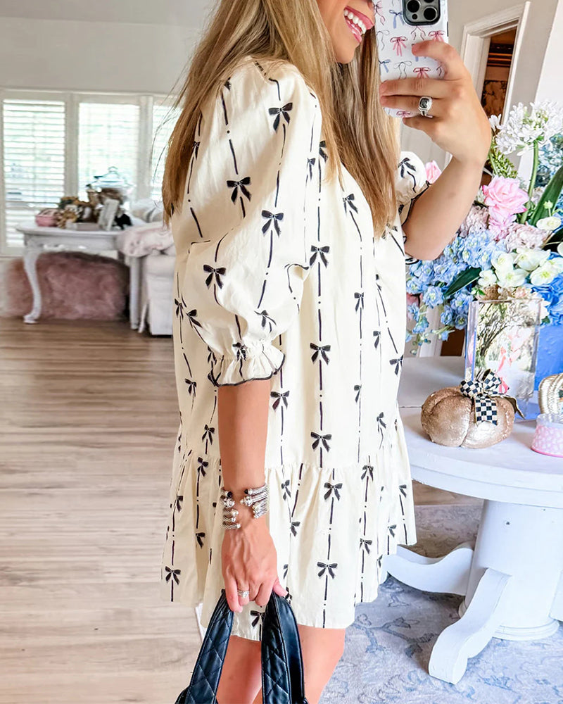 Abito con fiocco e maniche a balze