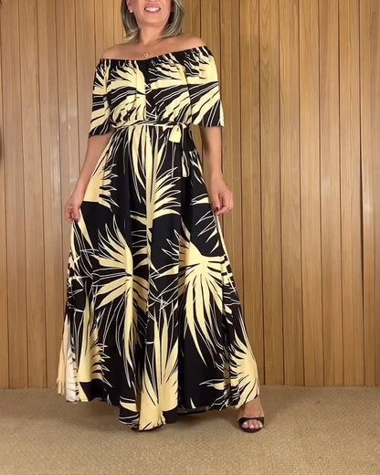 Abito con stampa a foglie e spalle scoperte