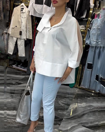 Camicetta con fiori e cuciture in pizzo sul risvolto