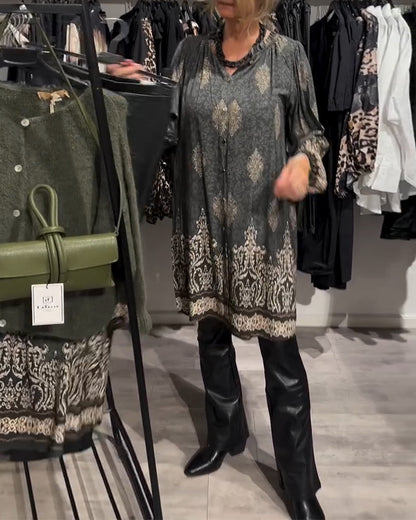 Abito con stampa vintage e bottoni a bavero