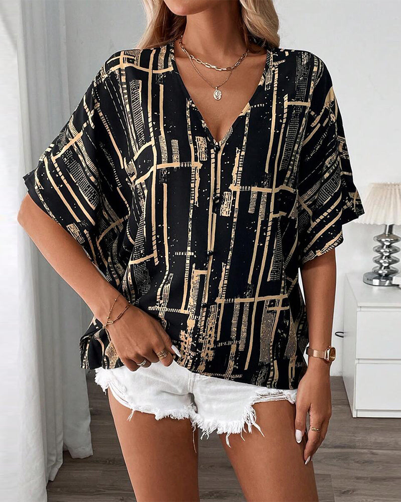 Bedruckte Retro-Bluse mit Fledermausärmeln und V-Ausschnitt