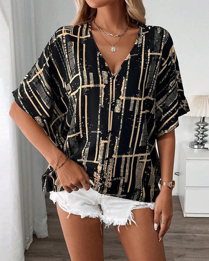 Bedruckte Retro-Bluse mit Fledermausärmeln und V-Ausschnitt
