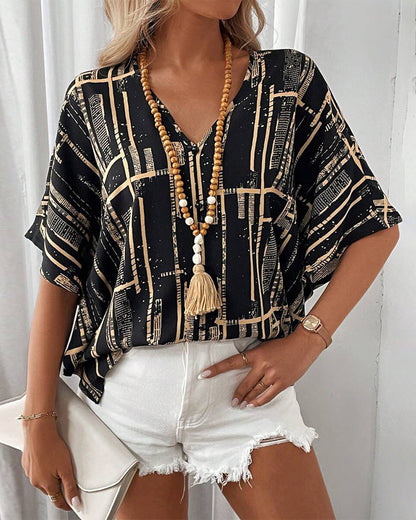 Bedruckte Retro-Bluse mit Fledermausärmeln und V-Ausschnitt