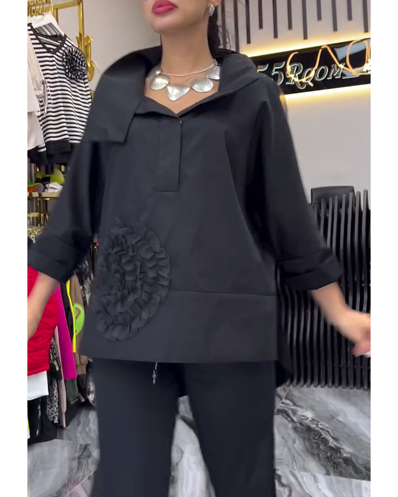 Camicetta con fiori e cuciture in pizzo sul risvolto