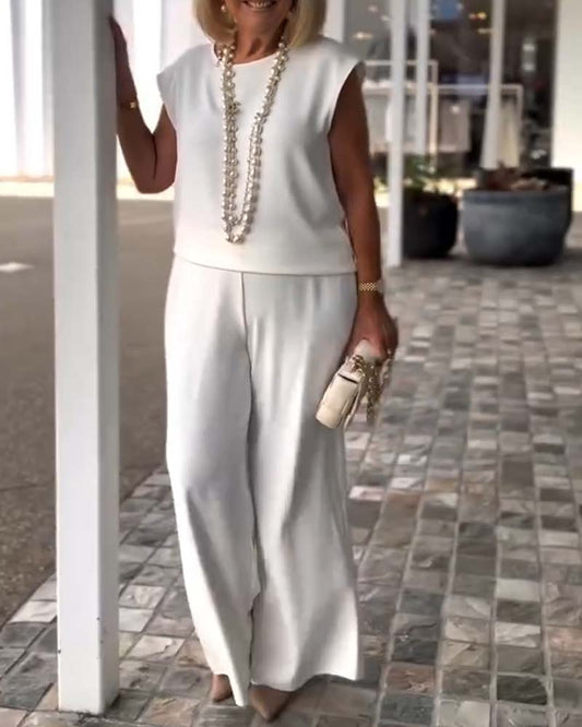 Completo con pantaloni larghi in tinta unita e temperamento