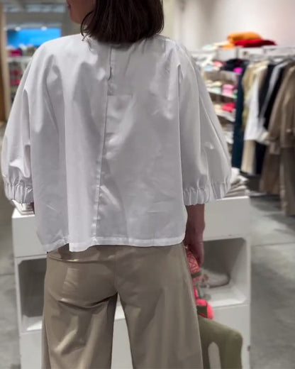 Camicetta ampia tinta unita con maniche a pipistrello