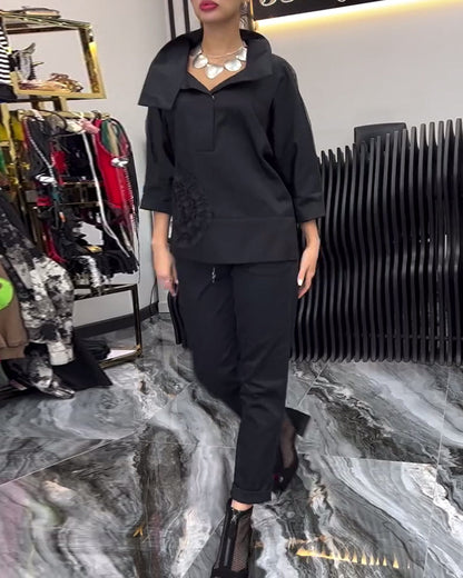 Camicetta con fiori e cuciture in pizzo sul risvolto