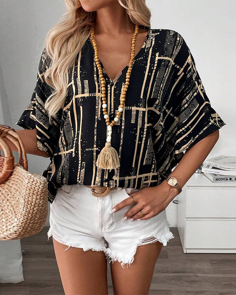 Bedruckte Retro-Bluse mit Fledermausärmeln und V-Ausschnitt