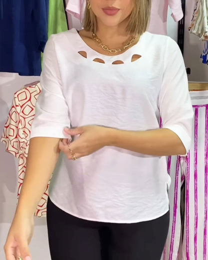 Blusa a tinta unita con scollo tondo e scollo a V