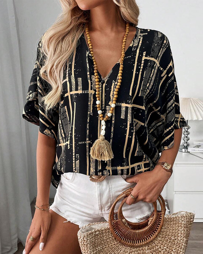 Bedruckte Retro-Bluse mit Fledermausärmeln und V-Ausschnitt