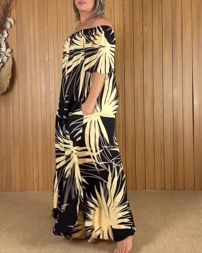 Abito con stampa a foglie e spalle scoperte