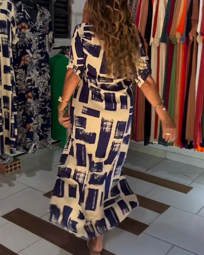 Abito a quadri con spacchi sul revers e blocchi di colore